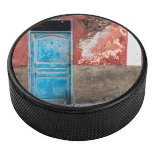 Colourful wall with blue door hockey puck