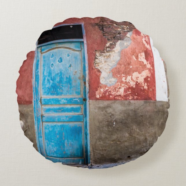 Colourful wall with blue door round cushion (Front)