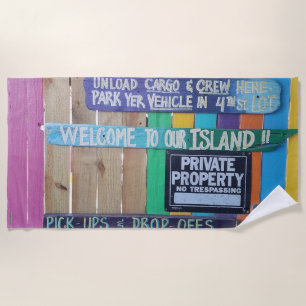 Colourful Welcome Island sign Carribean Beach Towel
