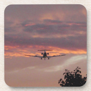 Commercial Jet Landing At Sunset Coaster