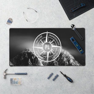 Compass star emblem monogram dramatic mountains desk mat
