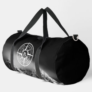 Compass star emblem monogram dramatic mountains duffle bag