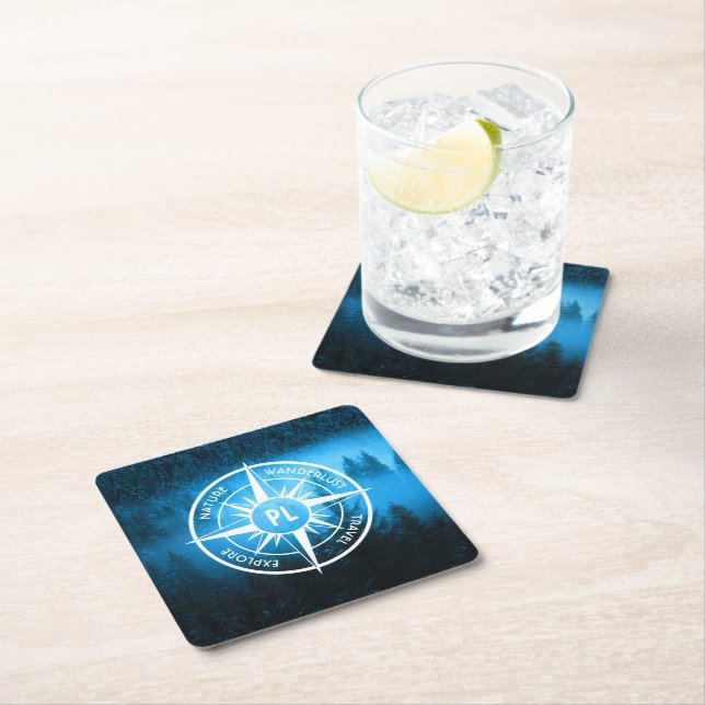 Compass star emblem monogram fog in spruce forest square paper coaster (Insitu)
