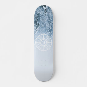 Compass star emblem monogram winter spruce forest skateboard