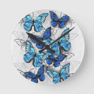 Composition of White and Blue Butterflies Round Clock