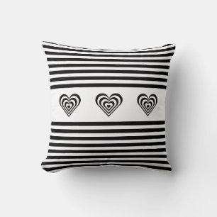 Concentric hearts on black & white striped cushion
