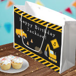 Construction Happy Birthday with Name and Age Boy Large Gift Bag<br><div class="desc">Celebrate your little one's special day with this custom boy gift bag with an adorable construction theme. The gift bag has a dump truck and excavator working together at a road construction site. There are also orange traffic cones, a dirt pile, and yellow and black stripes. Add your Happy Birthday...</div>