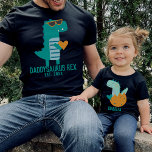 Cool Dino Daddysaurus Rex New Dad Father's Day T-Shirt<br><div class="desc">Customisable text design with a cool modern teal T-rex in sunglasses holding a heart,  gift for Father's day,  Birthday,  or Christmas. Find a matching child's dinosaur shirt in my collection "daddy and me designs".</div>