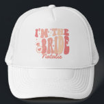 Cool It's Me Hi I'm the Bride Its Me Personalised Trucker Hat<br><div class="desc">Introducing the Cool It's Me Hi I'm the Bride It's Me Personalised Trucker Hat – a trendy and cute accessory in a delightful peach coral pink shade that captures the essence of your bride era. This personalised trucker hat is not just a fashion statement but a symbol of your upcoming...</div>