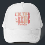 Cool It's Me Hi I'm the Bride Its Me Personalised Trucker Hat<br><div class="desc">Introducing the Cool It's Me Hi I'm the Bride It's Me Personalised Trucker Hat – a trendy and cute accessory in a delightful peach coral pink shade that captures the essence of your bride era. This personalised trucker hat is not just a fashion statement but a symbol of your upcoming...</div>