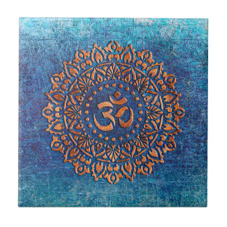 Copper Colour Ohm Symbol Mandala on Blue backgroun Ceramic Tile