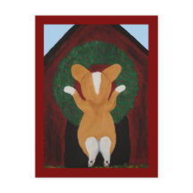 Corgi putting Christmas Wreath on Doghouse