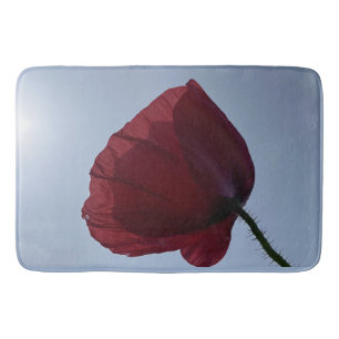Cornish red poppy with grey sky bath mat