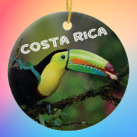 Costa Rica Toucan Ceramic Ornament<br><div class="desc">Costa Rica Toucan photo commemorative ornament to celebrate happy memories of your tropical vacation. Photo of a colourful Toucan in a tree,  along with Costa Rica in fun typography. Choose your ornament shape.</div>