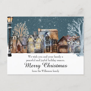 Cosy Winter Village at Night with Falling Snow Postcard