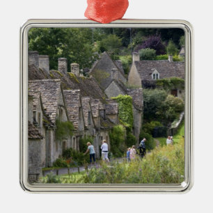 Cotswold stone cottages in the village of metal tree decoration