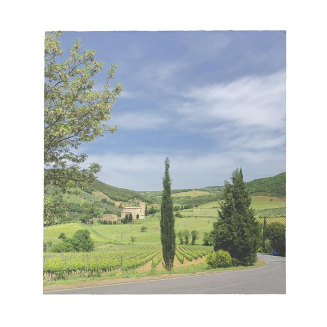 Country road curving between cypress trees in notepad (Front)