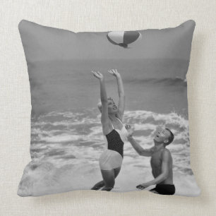Couple Playing with a Beachball Cushion
