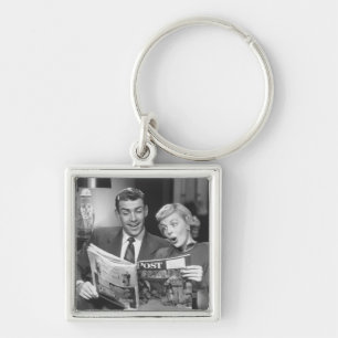 Couple Reading Magazine Key Ring