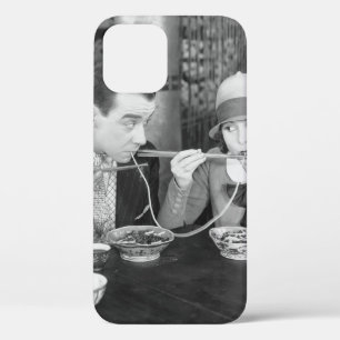 Couple sharing a noodle in a restaurantvintage, fo iPhone 12 case