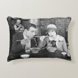 Couple sharing a noodle in a restaurantvintage, fo decorative cushion