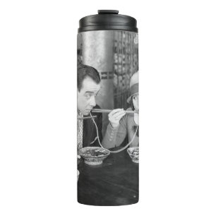 Couple sharing a noodle in a restaurantvintage, fo thermal tumbler
