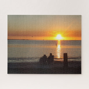 Couple Sit On Beach At Sunset Jigsaw Puzzle