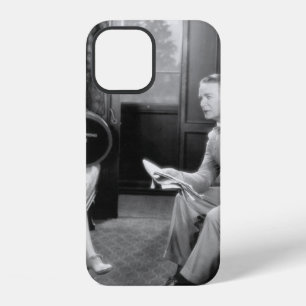 Couple sitting together in a compartment of a trai iPhone 12 case