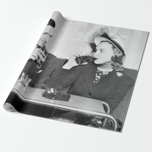 Couple sitting together in a restaurant flirting w wrapping paper (Unrolled)