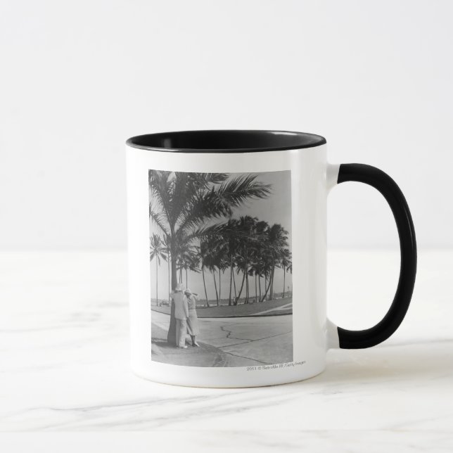 Couple standing at palm tree Rear view B&W Mug (Right)