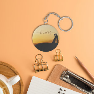 Couple standing during sunset keychain. keychain