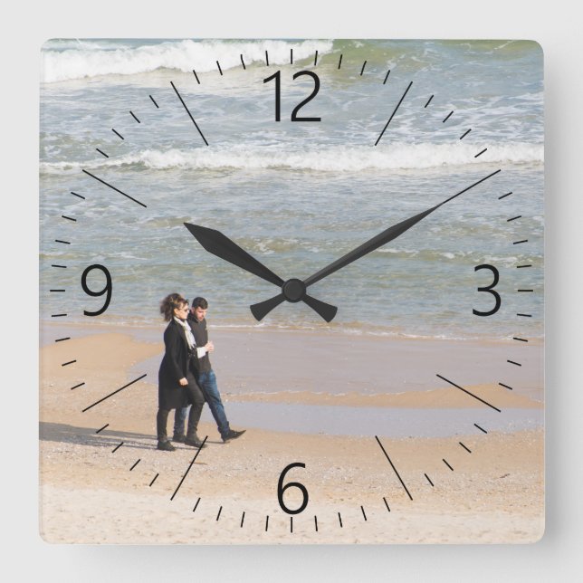 Couple walking along a shoreline square wall clock (Front)