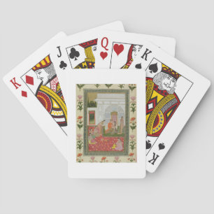 Couple with female attendants and musicians playing cards