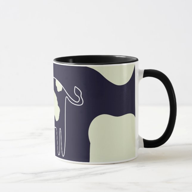 Cow print cup on navy blue background with white s (Right)