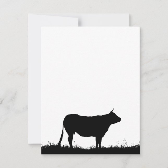 Cow standing resolutely on a dike, with copy space (Front)