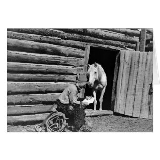 Cowboy and a horse looking at a letter