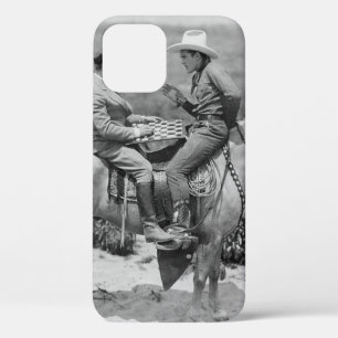 Cowboy and businessman playing checkers on horseba iPhone 12 case