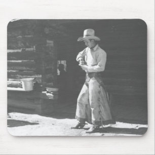 Cowboy eating from a Peter Pan peanutbutter can. Mouse Pad
