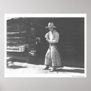 Cowboy eating from a Peter Pan peanutbutter can. Poster