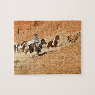Cowboy herding horses jigsaw puzzle