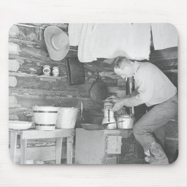 Cowboy making coffee inside the bunkhouse mouse pad (Front)