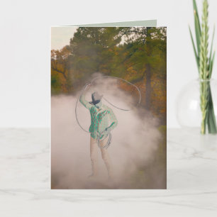 Cowboy man roping stirring up dust out west card