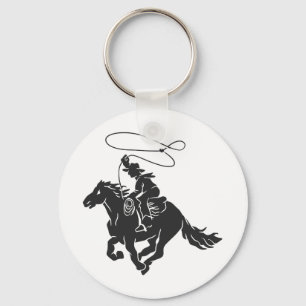 Cowboy on bucking horse running with lasso key ring