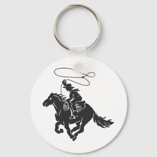 Cowboy on bucking horse running with lasso key ring