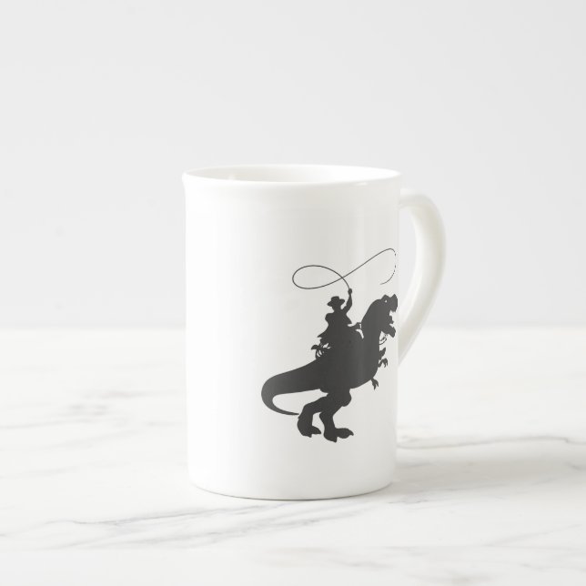 Cowboy riding dinosaur in the prehistoric era bone china mug (Front Right)