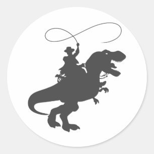 Cowboy riding dinosaur in the prehistoric era classic round sticker