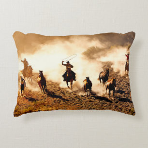 Cowboys chasing wilding horses. roping and riding, decorative cushion