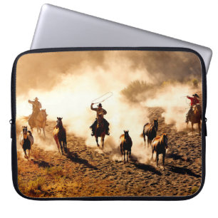 Cowboys chasing wilding horses. roping and riding, laptop sleeve