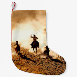 Cowboys chasing wilding horses. roping and riding, small christmas stocking
