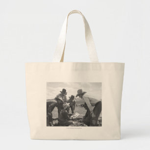 Cowboys looking a magazine large tote bag